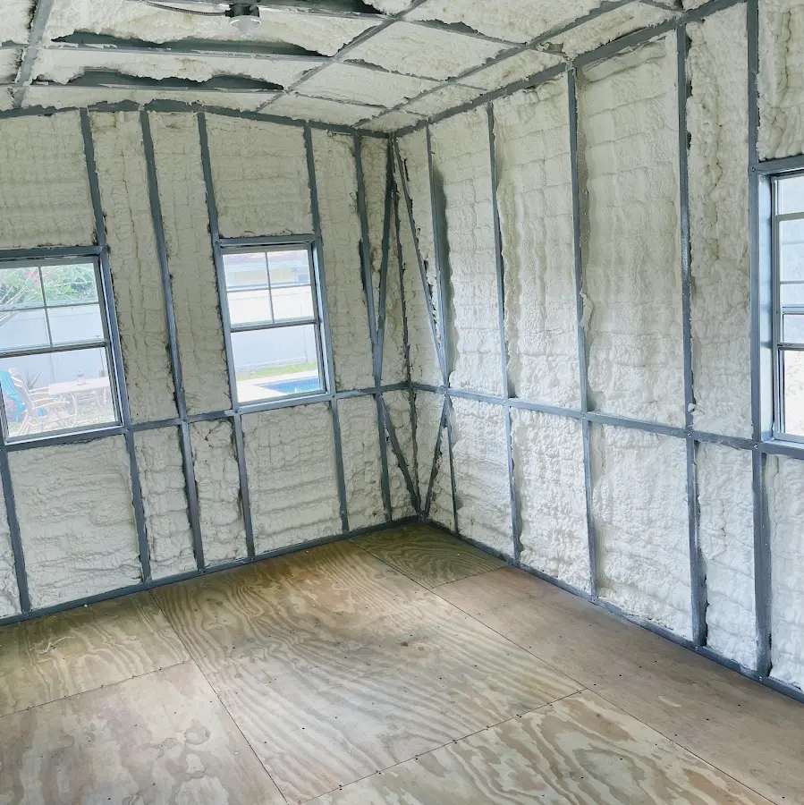 Closed-cell spray foam insulation applied to wall cavities in a residential project in Turner